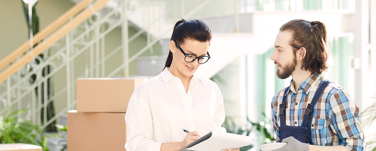 Woman signing for packages