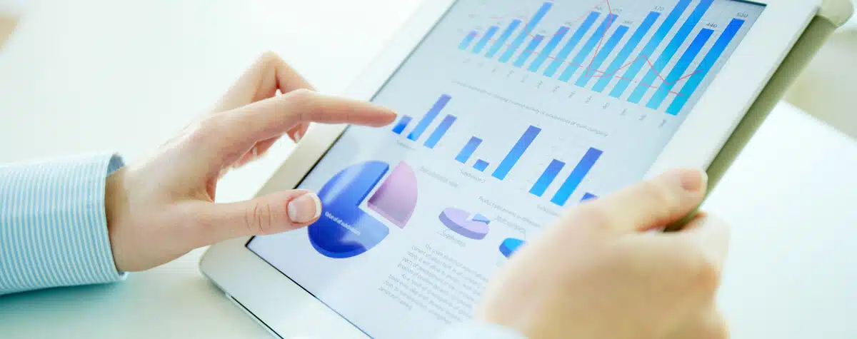 Someone using a tablet and analyzing online fundraising campaigns