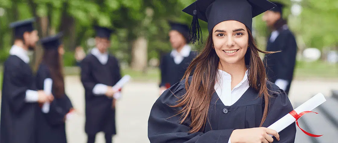 graduate with degree in her hand