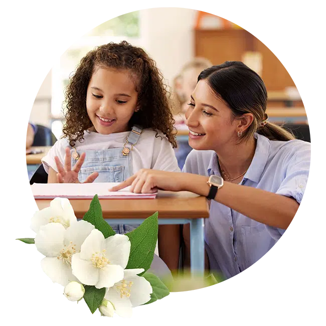 Mom and daughter working on home work together and they both are smiling