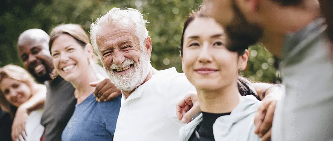group of people with their arms around each other