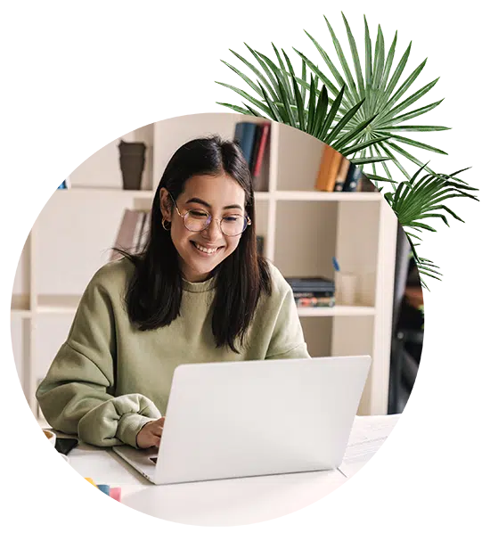 Happy woman staring at her computer