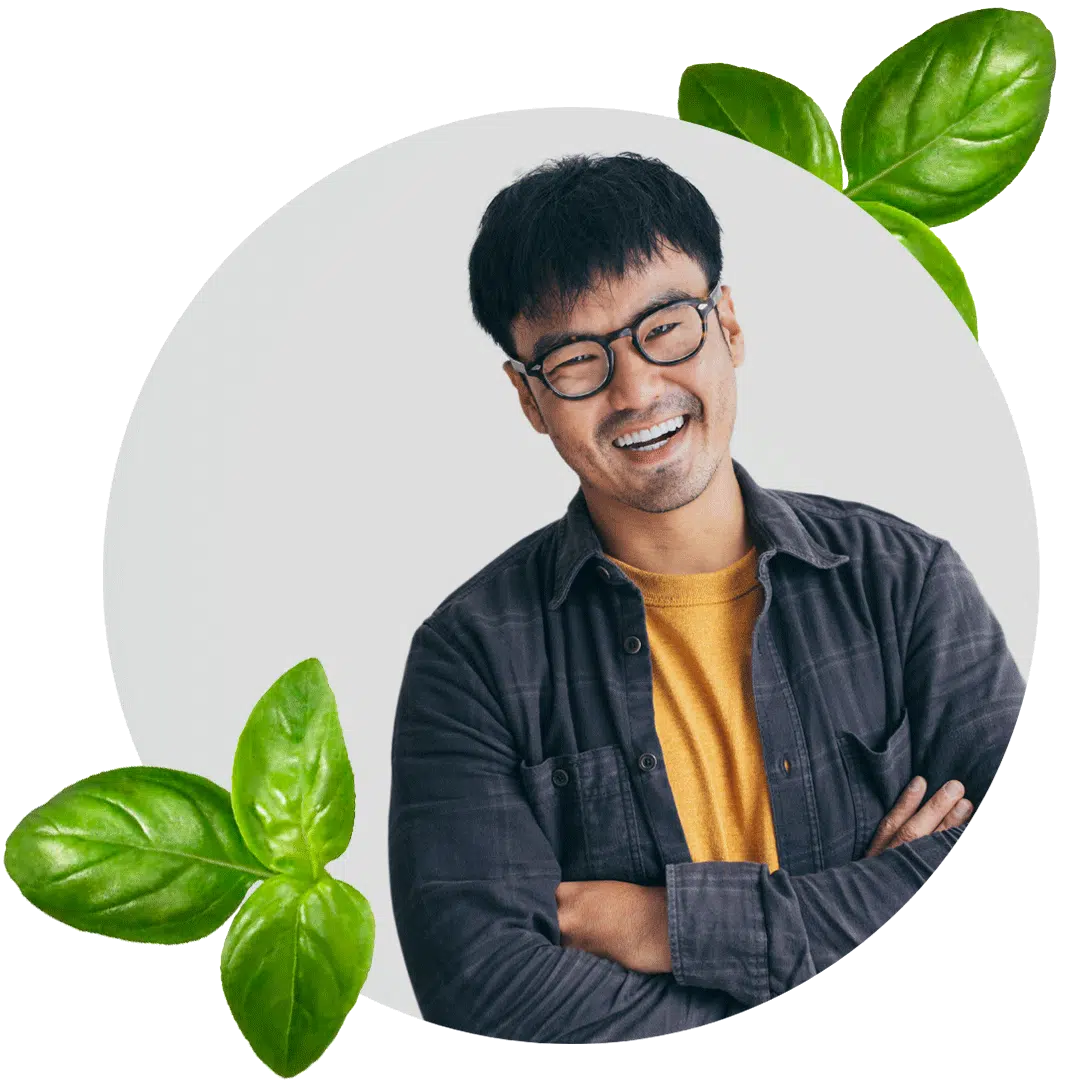 Bloomerang makes their customers smile like this man who is surrounded by leaves.