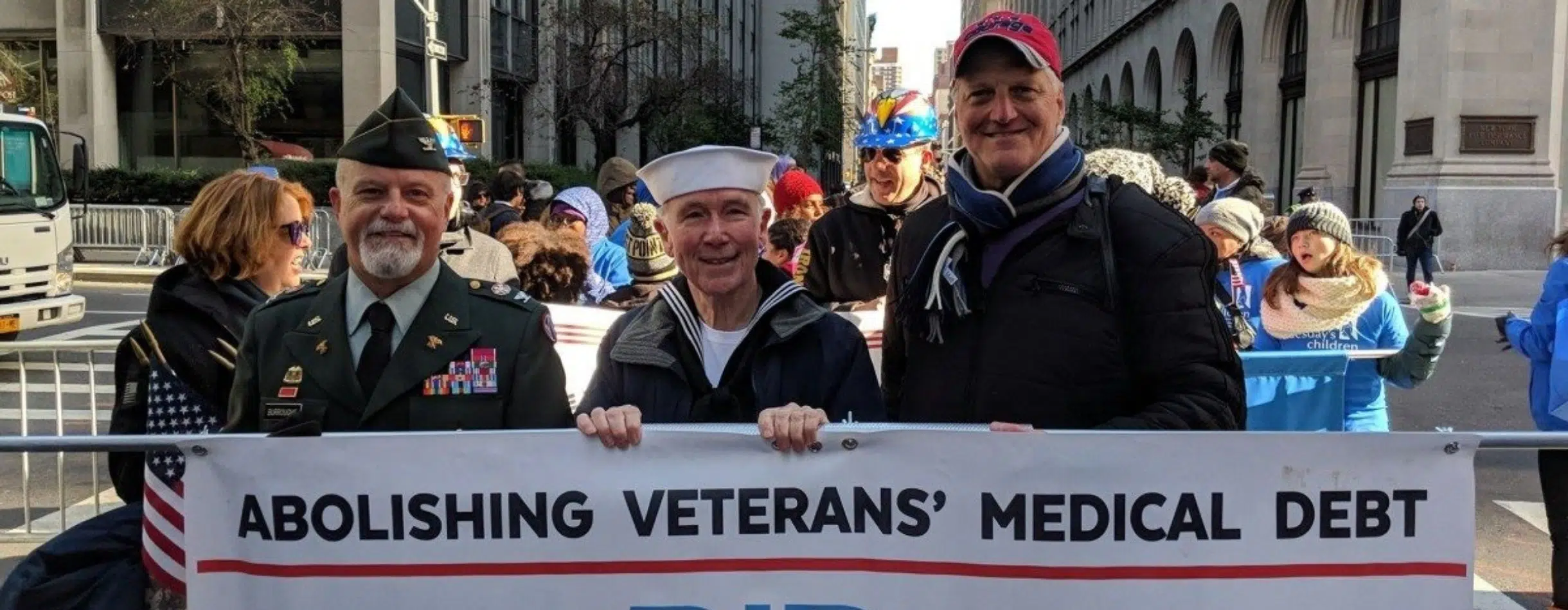 RIP Medical Debt staff and volunteers, a Bloomerang customer, marching in the street.
