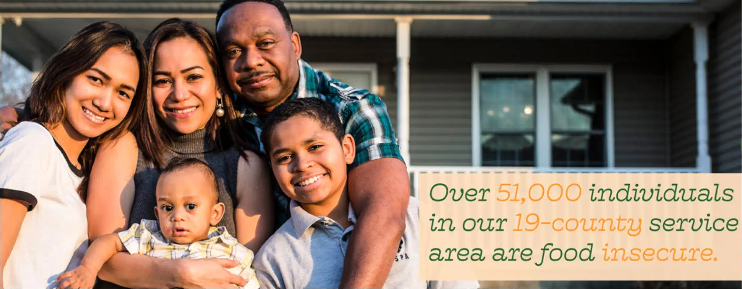 image of a family in front of a house